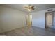 Bedroom featuring hardwood floors, a ceiling fan and access to an attached bathroom at 5657 E Dallas St, Mesa, AZ 85205
