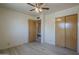Comfortable bedroom with hardwood flooring, closet, and nearby bathroom at 5657 E Dallas St, Mesa, AZ 85205