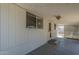 A spacious covered patio with white siding and plenty of natural light at 5657 E Dallas St, Mesa, AZ 85205