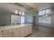 Spacious kitchen featuring white cabinets, stainless steel appliances, marble countertops, and seamless access to dining area at 5657 E Dallas St, Mesa, AZ 85205