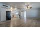 Spacious living room and kitchen area with hardwood floors and neutral paint tones throughout at 5657 E Dallas St, Mesa, AZ 85205