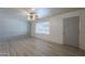 Inviting living room with large window and neutral paint color ready for move-in at 5657 E Dallas St, Mesa, AZ 85205