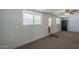 Living room has natural light, exterior door, and carpeted floor at 5657 E Dallas St, Mesa, AZ 85205