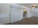 Finished basement living room with access to kitchen area at 5657 E Dallas St, Mesa, AZ 85205