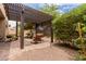 Covered outdoor patio with brick pavers and comfortable seating at 5749 S Dragoon Dr, Chandler, AZ 85249