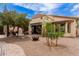 Outdoor backyard with covered patio, gravel, trees and fire pit at 5749 S Dragoon Dr, Chandler, AZ 85249