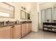 Bathroom featuring dual sinks, granite countertops, and ample storage space at 5749 S Dragoon Dr, Chandler, AZ 85249