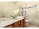 Neutral bathroom with a large vanity, white countertops and a tub at 5749 S Dragoon Dr, Chandler, AZ 85249