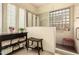 Modern bathroom with a glass block window and tiled walk-in shower at 5749 S Dragoon Dr, Chandler, AZ 85249