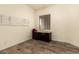 This bedroom has wood flooring, a window and desk with storage at 5749 S Dragoon Dr, Chandler, AZ 85249