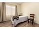 Bright bedroom with hardwood floors, natural light and a queen bed at 5749 S Dragoon Dr, Chandler, AZ 85249