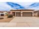 Charming single-story home featuring a two-car garage, desert landscaping, and neutral color palette at 5749 S Dragoon Dr, Chandler, AZ 85249
