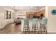 Open-concept kitchen with stainless steel appliances, granite countertops, and breakfast bar seating at 5749 S Dragoon Dr, Chandler, AZ 85249