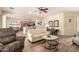 Cozy living room with hardwood floors, neutral walls, and views of the kitchen and dining area at 5749 S Dragoon Dr, Chandler, AZ 85249