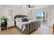 Relaxing bedroom features a plush bed with stylish pillows and a large window with a view at 6001 N 10Th Way, Phoenix, AZ 85014