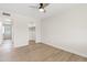 Bedroom featuring wood floors, ceiling fan, and a doorway to a walk in closet at 6001 N 10Th Way, Phoenix, AZ 85014