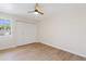 Bedroom featuring wood floors, ceiling fan, and closet at 6001 N 10Th Way, Phoenix, AZ 85014