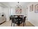 Elegant dining room with a modern chandelier, stylish decor, and comfortable seating for four at 6001 N 10Th Way, Phoenix, AZ 85014