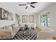 Bright living room with modern furnishings, a ceiling fan, and plenty of natural light at 6001 N 10Th Way, Phoenix, AZ 85014