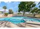 Relaxing pool area featuring clear blue water and surrounding green spaces at 6001 N 10Th Way, Phoenix, AZ 85014