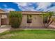 Backyard features manicured landscaping, rocks, grass, and desert plants at 6085 S Wilson Dr, Chandler, AZ 85249