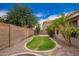 Landscaped backyard featuring a patch of grass, mature trees, and block wall, offering a private outdoor space at 6085 S Wilson Dr, Chandler, AZ 85249