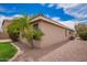 View of the exterior corner, stucco, and roof with rock landscaping and a mature palm tree at 6085 S Wilson Dr, Chandler, AZ 85249
