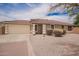 Charming single story home features a two car garage, desert landscaping, and a red tiled roof at 6085 S Wilson Dr, Chandler, AZ 85249