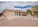 Charming single story home features a two car garage, desert landscaping, and a red tiled roof at 6085 S Wilson Dr, Chandler, AZ 85249