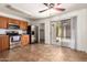 The kitchen features stainless steel appliances, wood cabinetry, and tile floors. Sliding glass door to the backyard at 6085 S Wilson Dr, Chandler, AZ 85249