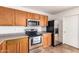Close up of the well-equipped kitchen with stainless steel appliances and tile floors at 6085 S Wilson Dr, Chandler, AZ 85249