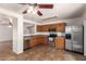 Open concept kitchen with stainless steel appliances, tile floors and generous cabinet space at 6085 S Wilson Dr, Chandler, AZ 85249