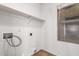 A laundry room with built-in shelving and a window for natural light at 6085 S Wilson Dr, Chandler, AZ 85249