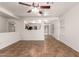 Open living room featuring neutral walls, tile floors, and a ceiling fan at 6085 S Wilson Dr, Chandler, AZ 85249