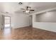 Open living room featuring neutral walls, tile floors, and a ceiling fan at 6085 S Wilson Dr, Chandler, AZ 85249