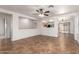 Open living room featuring neutral walls, tile floors, and a ceiling fan at 6085 S Wilson Dr, Chandler, AZ 85249