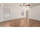 Open living room featuring neutral walls, tile floors, and a ceiling fan at 6085 S Wilson Dr, Chandler, AZ 85249