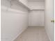 View of a walk-in closet with neutral carpet and rod for hanging clothes at 6085 S Wilson Dr, Chandler, AZ 85249