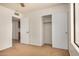 Bedroom includes a closet with sliding doors, neutral walls, carpet, and ample lighting at 6602 W Ironwood Dr, Glendale, AZ 85302
