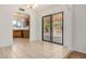 Open dining area with neutral tile flooring and sliding door access to outdoor patio at 6602 W Ironwood Dr, Glendale, AZ 85302