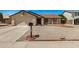 Inviting single-story home featuring a well-kept gravel front yard and a classic mailbox at 6602 W Ironwood Dr, Glendale, AZ 85302