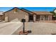 Charming single-story home with a low-maintenance gravel yard and a secure front entrance at 6602 W Ironwood Dr, Glendale, AZ 85302