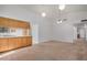 Spacious living room with neutral carpet and a ceiling fan with lighting at 6602 W Ironwood Dr, Glendale, AZ 85302