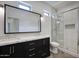 Elegant bathroom featuring a modern vanity with double sinks and a tiled shower at 7214 E Rustling Pass, Scottsdale, AZ 85255