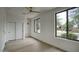 Well-lit bedroom with wood-look floors and modern ceiling fan at 7214 E Rustling Pass, Scottsdale, AZ 85255