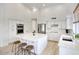 Spacious kitchen boasts a large island, modern appliances, white cabinetry, and plenty of counter space at 7214 E Rustling Pass, Scottsdale, AZ 85255