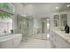 Bright main bathroom features a soaking tub, walk-in shower, and double vanity at 7214 E Rustling Pass, Scottsdale, AZ 85255