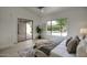 Bright main bedroom with a sliding door to the backyard swimming pool at 7214 E Rustling Pass, Scottsdale, AZ 85255