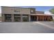 An inviting wine bar and restaurant exterior with ample parking and outdoor seating for patrons at 7214 E Rustling Pass, Scottsdale, AZ 85255