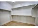 Spacious walk-in closet with shelves and rods for ample storage at 7214 E Rustling Pass, Scottsdale, AZ 85255